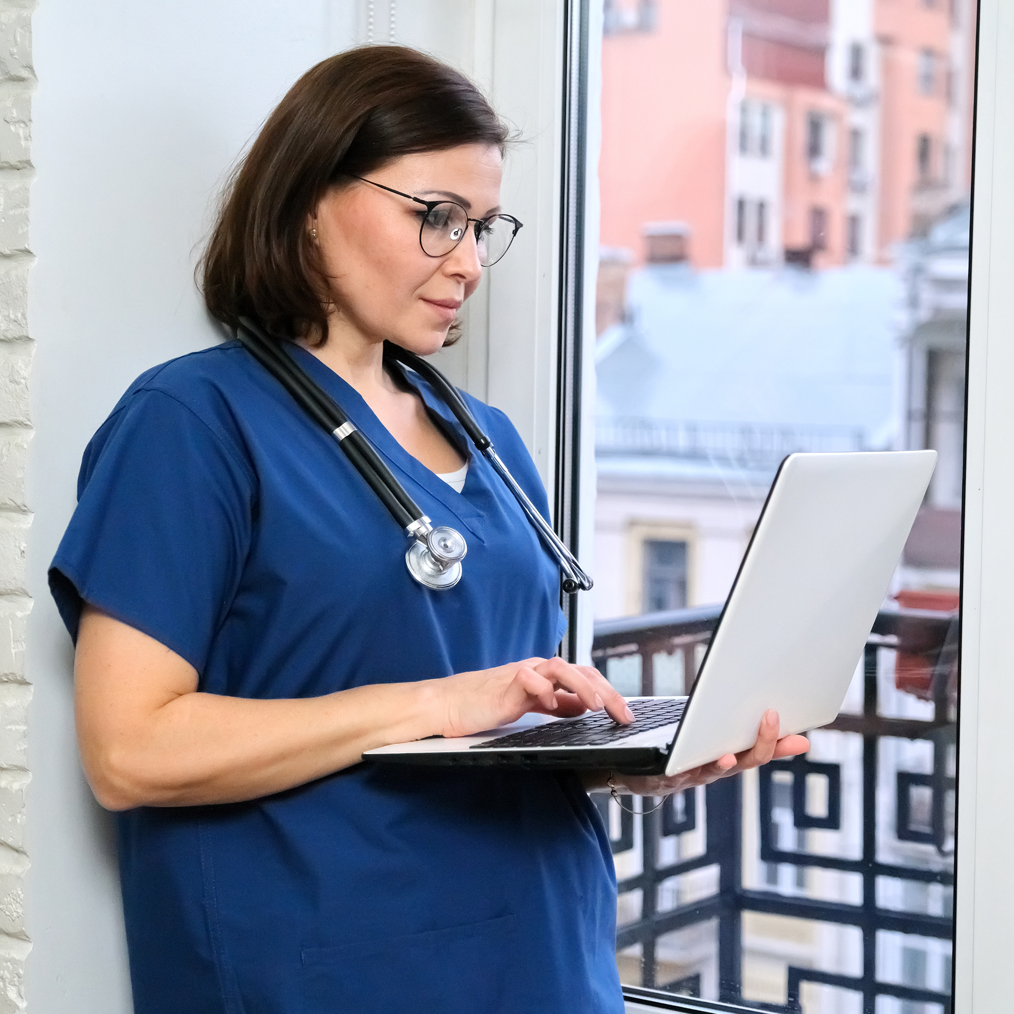 Nurse learning on laptop with LIPHA